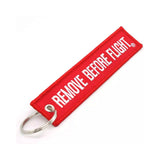 Red keychain with 'REMOVE BEFORE FLIGHT' text on both side.