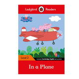 Book cover of 'In a Plane' from Ladybird Readers featuring Peppa Pig and her family in an airplane.
