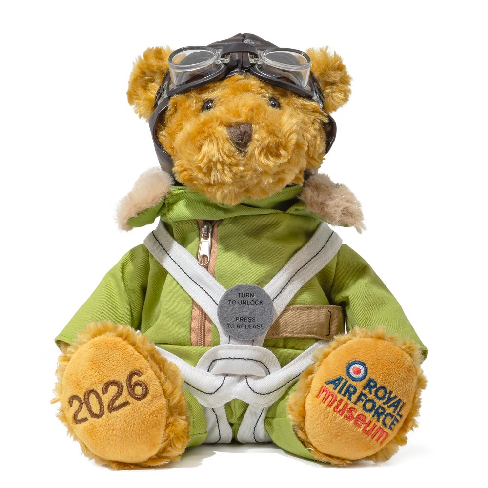 RAF Museum 2026 Pilot Bear, wears a parachute harness and pack, commemorating the first use of this iconic life-saving equipment in the RAF, one hundred years ago.