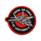 RAF Offical license F-35 lightning II embroidered fabric badge in black and red with the aircraft design in the centre.