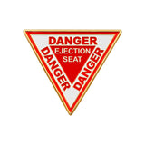 Iconic Danger Ejection Seat Triangle pin badge.