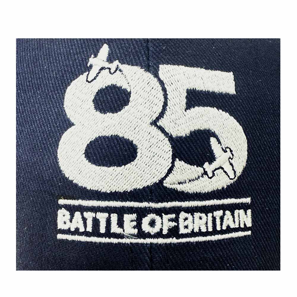 Navy baseball cap with embroidered Battle of Britain 85th Anniversary logo on the front.