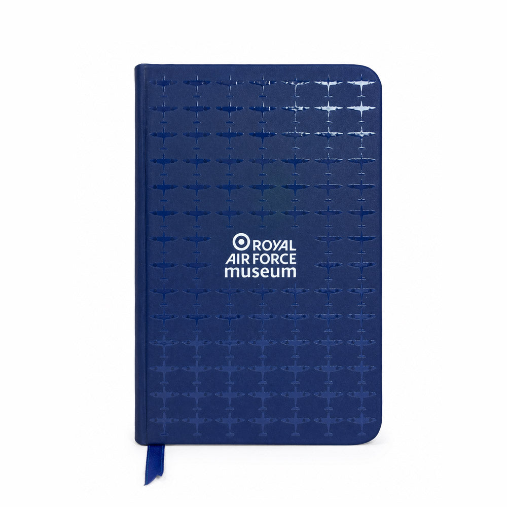 A Navy A6 notebook with an all-over Spitfire pattern with a premium spot gloss varnish finish, featuring a hard PU cover, elastic closure, ribbon page marker, and 96 lined pages.
