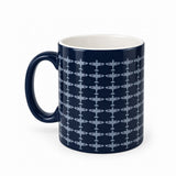Glossy dark navy blue ceramic mug with a repeating grey Spitfire pattern. An exclusive RAF Museum design.