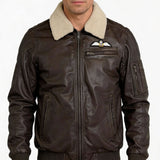 Royal Air Force Museum aviator jacket in heavy brown waxed leather, with detachable fleece collar, embroidered RAF Wings badge on left chest, and multiple zip pockets on sides, chest, and sleeve.
