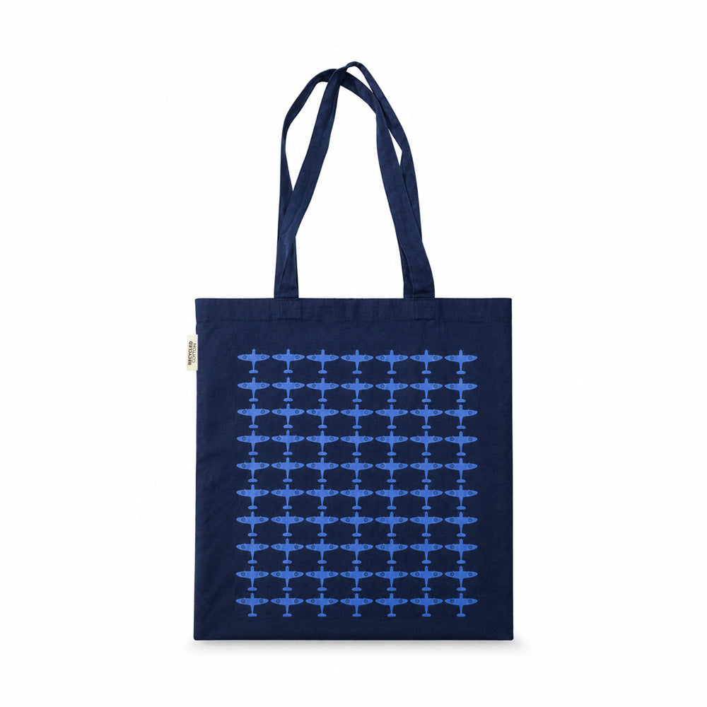 Navy recycled cotton tote bag with long handles, featuring a repeated blue Spitfire silhouette pattern across the front.