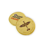 A gold collectible souvenir coin featuring the iconic Spitfire on one side and the RAF Museum logo on the reverse. Exclusive to the Royal Air Force Museum. 