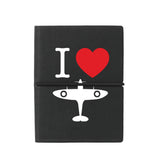 Compact A7 black notebook with soft cover featuring ‘I Love Spitfire’ design, plain coloured pages, and elastic strap, made exclusively for the Royal Air Force Museum.