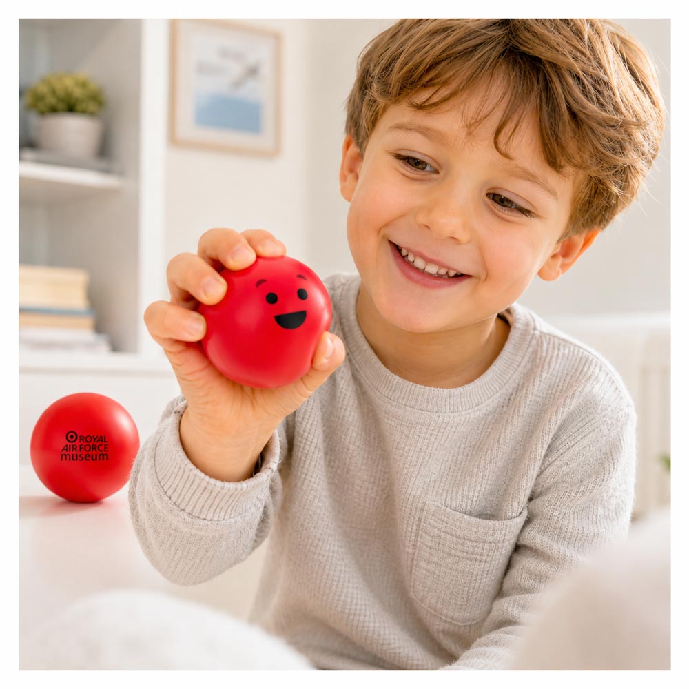 A soft, squishable red stress ball featuring the RAF Museum Blob face on one side and the RAF Museum logo on the other. Perfect for relieving everyday stress.